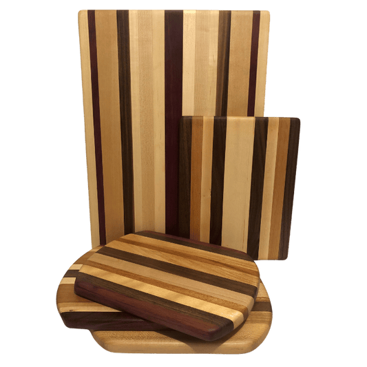 Handcrafted cheese and charcuterie boards made from reclaimed wood, featuring a striped pattern with different wood tones.