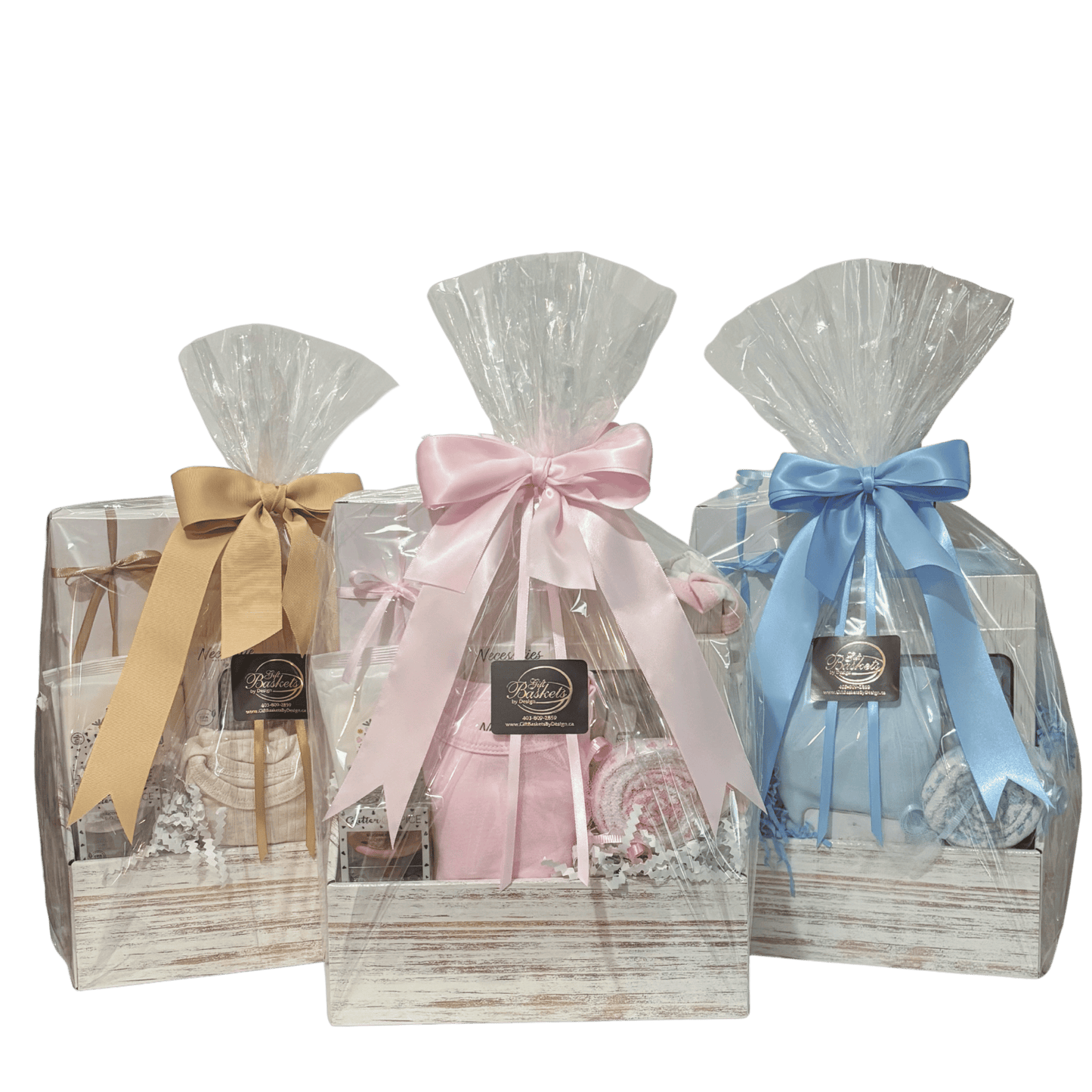 Little Beginnings baby gift baskets in neutral, pink and blue, beautifully wrapped with coordinating satin ribbon