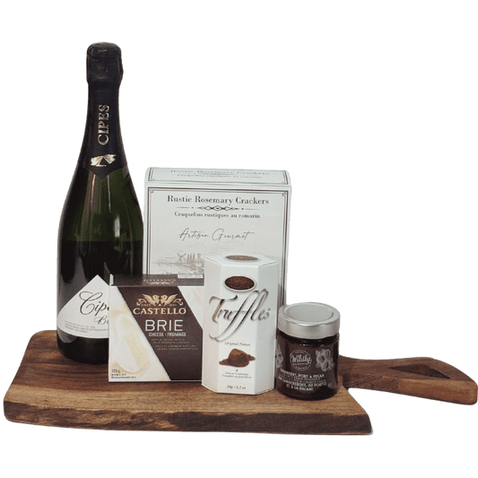A Toast to the Season holiday wine and cheese gift with Canadian sparkling wine, Brie, artisan crackers, cranberry spread and chocolate truffles on a wood serving board