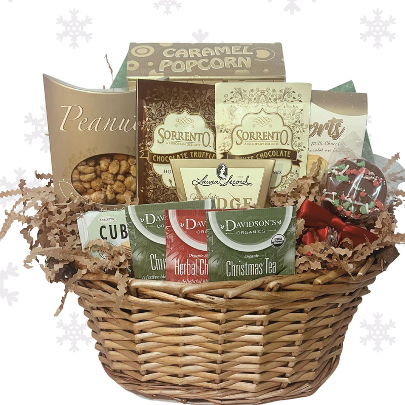 Comfort & Joy Holiday Gift Basket wrapped in gold and cream with festive ribbon, featuring hot chocolate, cookies, caramel popcorn, tea, and artisan chocolates.