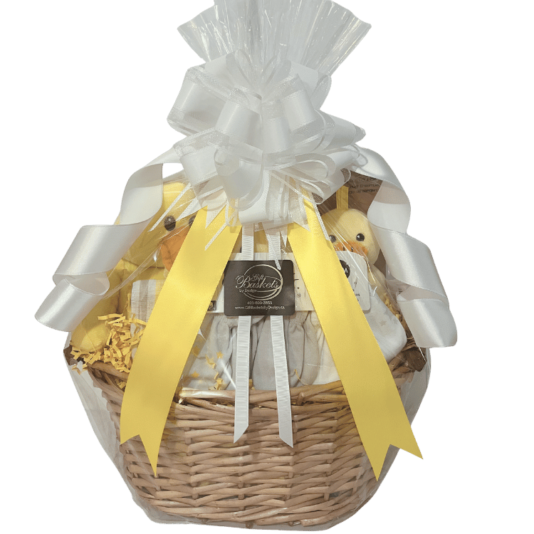 Ducky Dreams baby gift basket with white ribbon and yellow accents on a transparent background