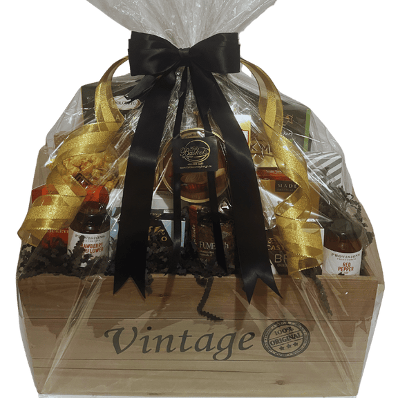 Luxurious gift crate dressed with black ribbons and bows, featuring a gold accent. The wooden cedar crate is labeled 'Vintage,' adding an elegant touch to the presentation