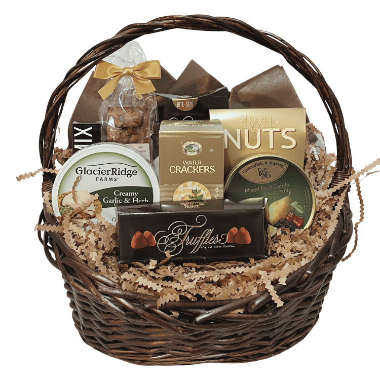 Wicker gift basket with assorted snacks and treats on a white background