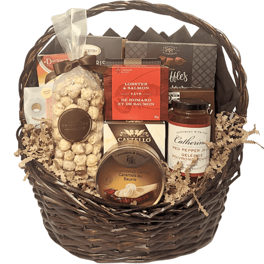 Luxury gourmet gift basket featuring artisan Canadian cheeses, smoked salmon pâté, handcrafted chocolates, gourmet crackers, specialty coffee, premium tea, popcorn, preserves, and entertaining favourites, beautifully presented for local Calgary gift delivery.