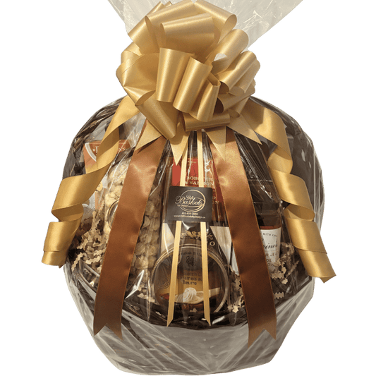 Luxury gourmet gift basket featuring artisan cheeses, smoked salmon pâté, handcrafted chocolates, gourmet crackers, specialty coffee, premium tea, popcorn, preserves, and entertaining favourites, beautifully presented for local Calgary gift delivery.