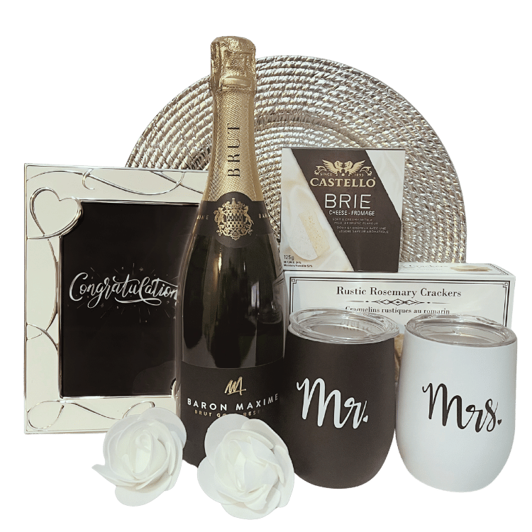 Engagement celebration gift with Baron Maxime Brut wine, artisan crackers, brie cheese, personalized stainless steel wine tumblers, and congratulations frame