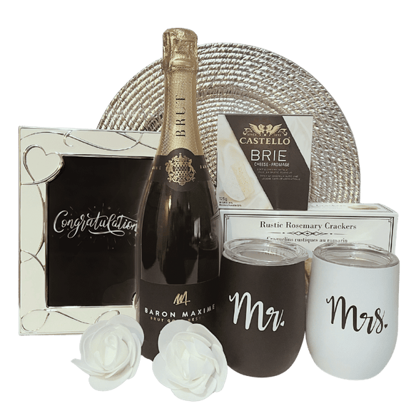 Engagement celebration gift with Baron Maxime Brut wine, artisan crackers, brie cheese, personalized stainless steel wine tumblers, and congratulations frame