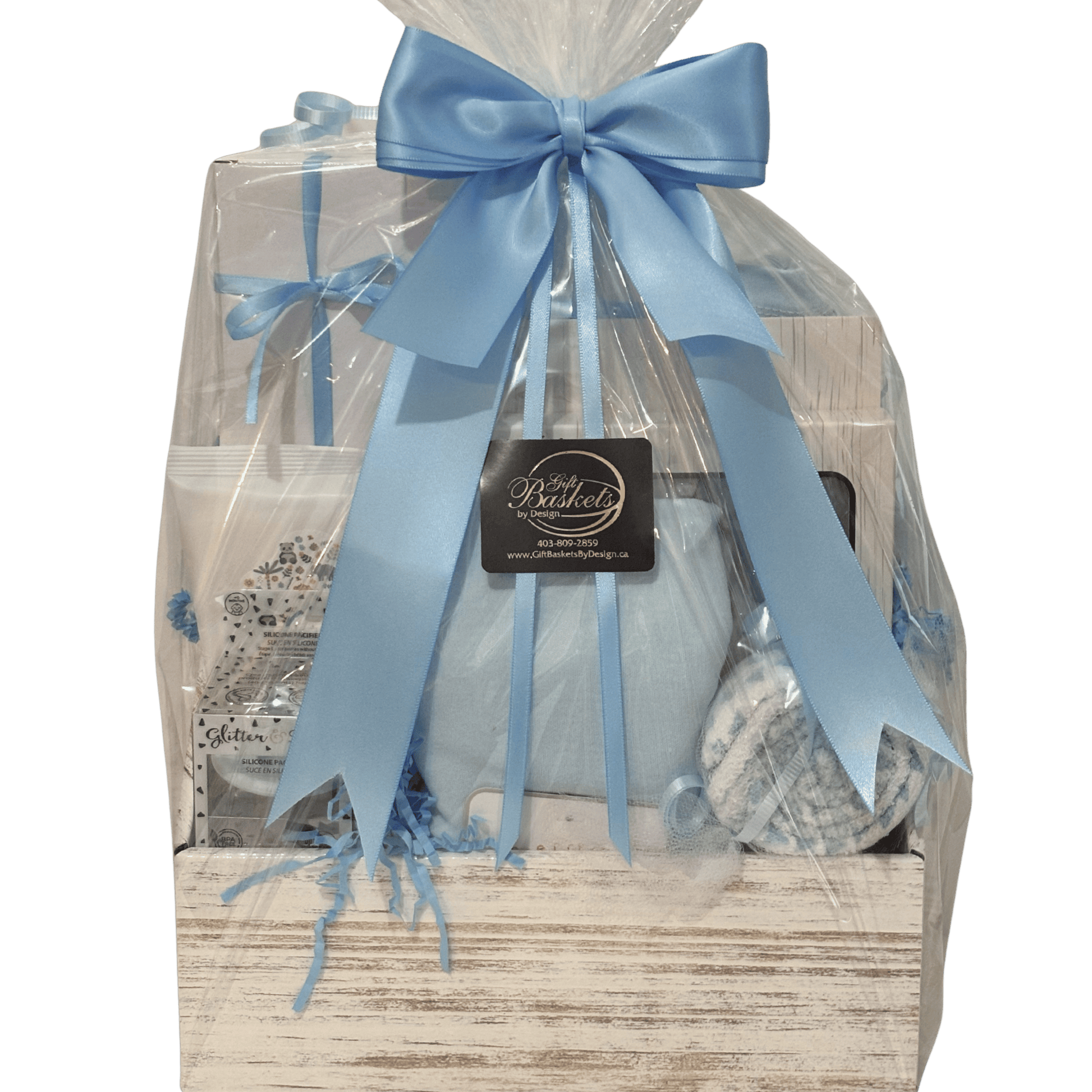 Little Beginnings blue baby gift basket with clothing and baby essentials in a white ladder box with blue satin ribbon
