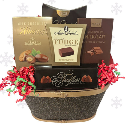 Chocolate gift basket with various chocolate items including almonds, fudge, and truffles on a white background.