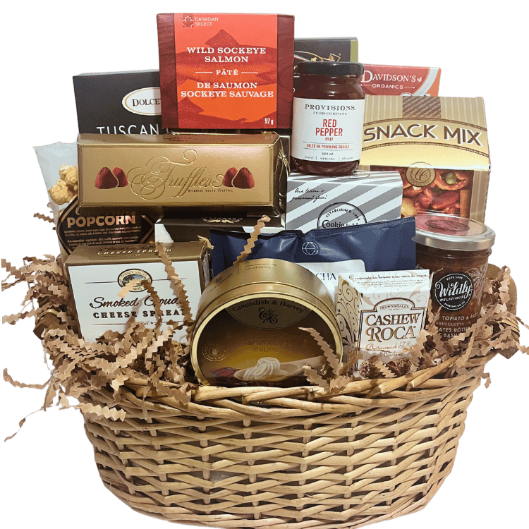 A golden wicker basket filled with gourmet treats, including cheese, crackers, chocolates, and tea