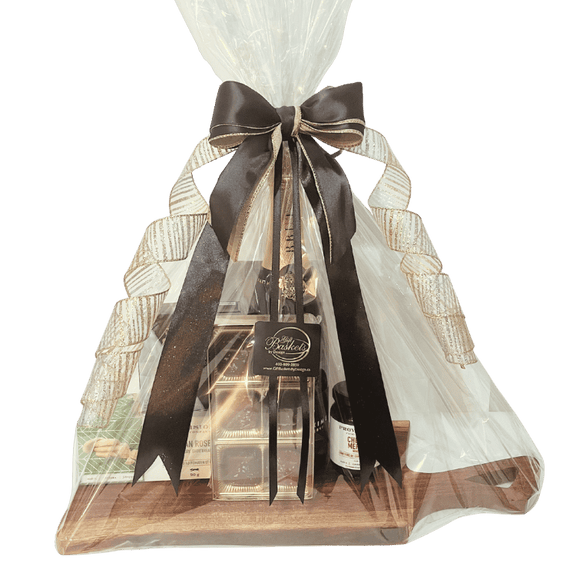 Perfect Wine Pairings Gift Basket wrapped with gold and black ribbons and bows with cellophane, available for local delivery in Calgary and surrounding areas