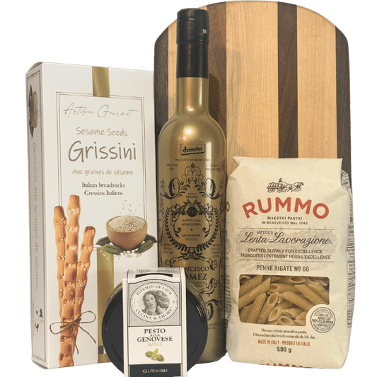 Rustic Elegance artisan pantry gift with handcrafted hardwood serving board, olive oil, pasta, pesto and breadsticks in Calgary.