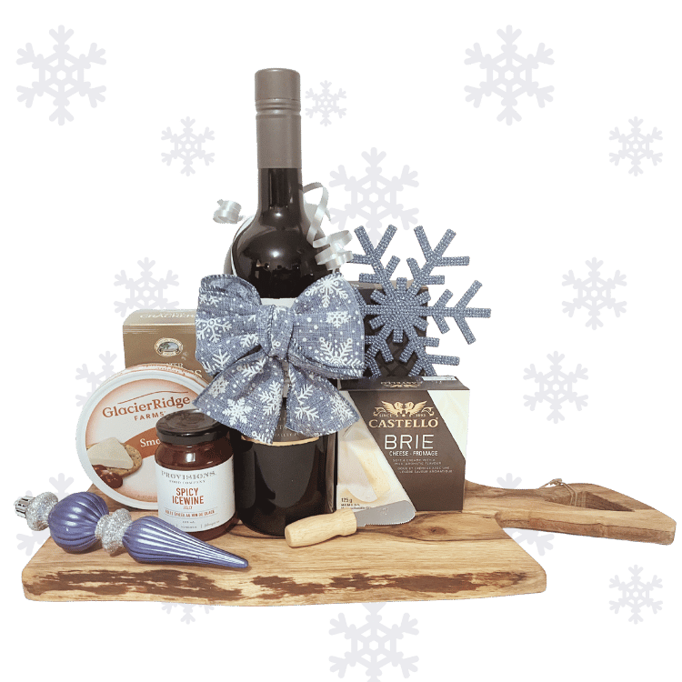 Wine & cheese gift basket with snacks on a wooden acacia board with snowflake decorations