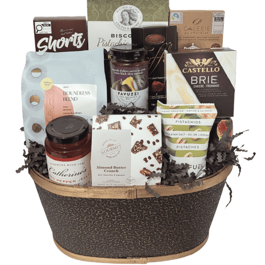 The Coffeehouse Gourmet Collection with Canmore-roasted coffee, chocolates, Brie and savoury gourmet treats in a black and gold basket
