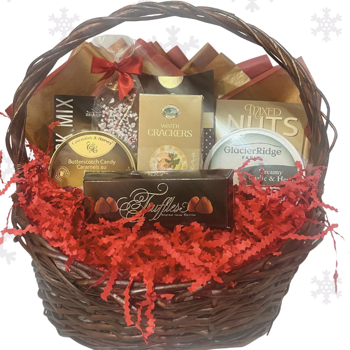 The Holiday Feast Gift Basket shown unwrapped in red and gold festive Christmas decor.