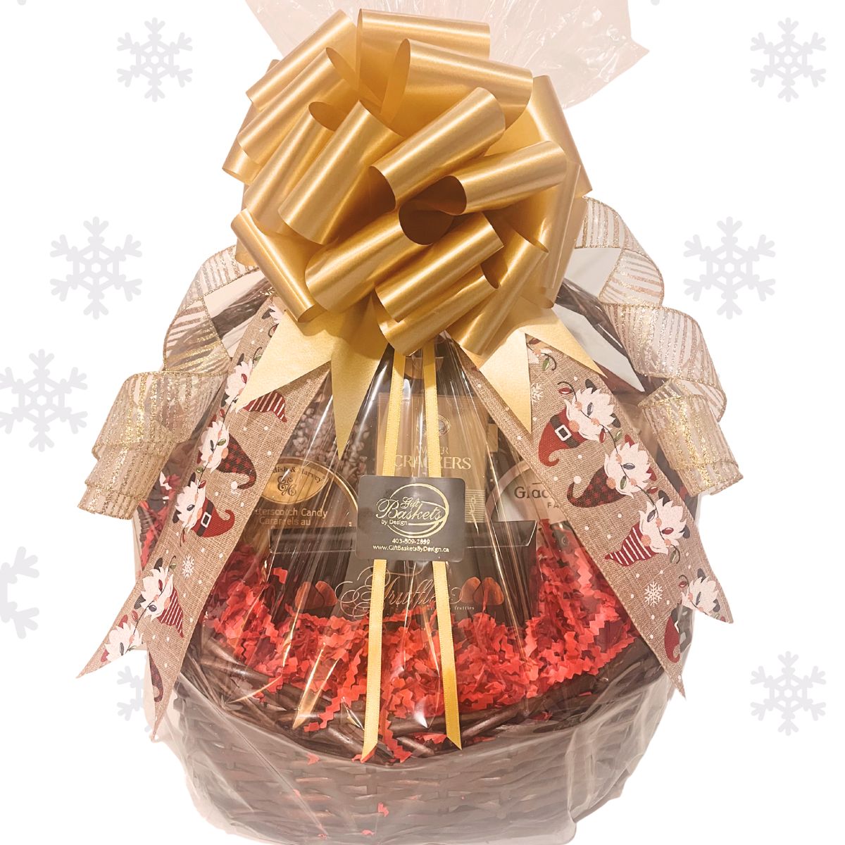 Holiday Gift basket with wrapped in cellophane, adorned with sparkly Christmas curled ribbon, on a white background.