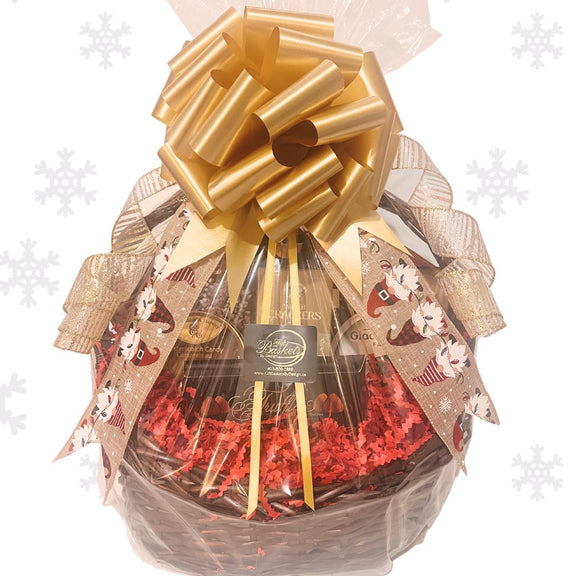 Holiday Gift basket with wrapped in cellophane, adorned with sparkly Christmas curled ribbon, on a white background.