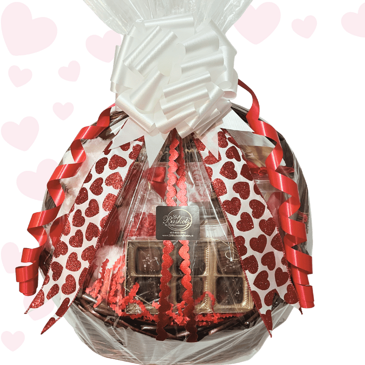 Timeless Romantic Valentine’s Day gift basket with plush teddy bear, artisan chocolates, caramel popcorn, Turkish delight, spa bath soak, candle, and romantic wine glass, wrapped with heart ribbons.