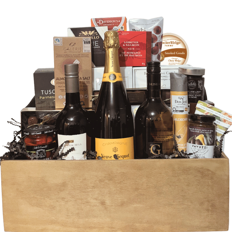 Ultimate Indulgence luxury wine gift basket shown unwrapped with three premium wines, artisan cheese, charcuterie, chocolates and gourmet foods, handcrafted in Calgary.