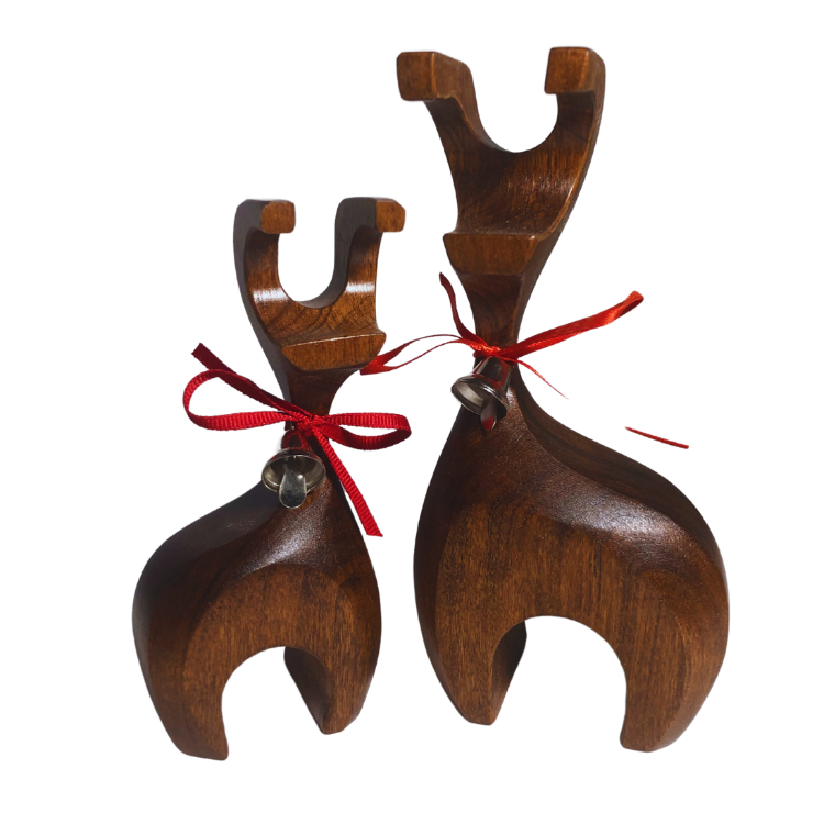 Handcrafted wooden reindeer with decorative bell, made from reclaimed oak, cherry, walnut, and maple hardwoods, finished with a walnut stain and protective lacquer, displayed on a cream background.